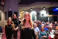 ABSN graduate entering auditorium.