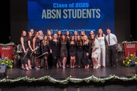 ABSN graduates gathering for a photo post-ceremony.