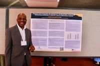 Nursing student with his research poster at 2026 Scholarship Day