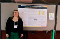 Nursing student with her research poster at the 2026 Scholarship Day