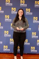 Nursing student posing with their Scholarship Day 2026 award