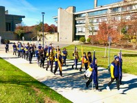 Corsair band lined up down the sidewalk
