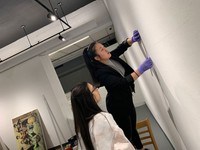 Students installing exhibition in the Campus Gallery