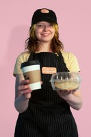 Café Uniform Photography, 2023, Bridget Landgren modeling a Kitty Corner hat and apron that I digitally embroidered 5.5 x 8.3 in.