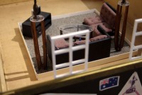 324 Broadway St. Fall River, 02721 (detail), 2025, vintage suitcase, wood, fabric, mixed media, 29 x 22 x 27 in.