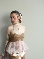 Look 4, 2026, strapless brown bodice with sheer pink peplum and lace up sleeve detail.