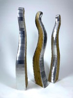Three Graces, 2025, aluminum and oiled plywood, three pieces each 48 x 6 x 18 in.
