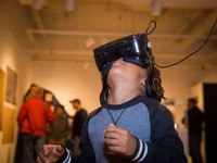 Child in gallery using virtual reality headset 