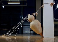 A Precarious Situation, 2020, handbuilt earthenware, upcycled and crocheted plastic bags, handmade paper from harvested plants, rocks