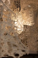 Enmeshed (detail), 2022, clay slip, cheese cloth, glue, led lights, wire, string, ~9’ x 10’ x 5’