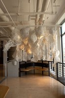 Enmeshed, 2022, clay slip, cheese cloth, glue, led lights, wire, string, ~9’ x 10’ x 5’
