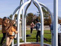 Visitors to UMass Dartmouth interact with Nancy Holt's Spinwinder (1991) on the occasion of its 30th anniversary celebration. Photo: Chris Diani