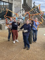 Katie Erwin, Kayleigh Williams,  Maddie Gonzalez, Mary Lou Nicholson and Stacy Savage carry the yet to be completed Head of the Sculpture Monster