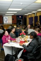 Members of the Frederick Douglass Unity House enjoying a meal together