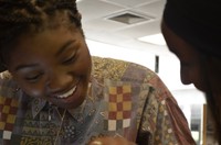 UMassD student working with a member of the Frederick Douglass Unity House