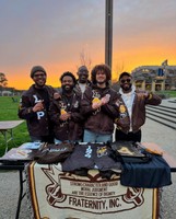 Fraternity brothers on the quad at dusk