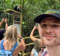 Cameron Hixon takes a selfie with a monkey in Costa Rica
