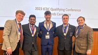 Araveti (second from left) and peers at the 2023 ICDC Qualifying Conference, Stonehill College