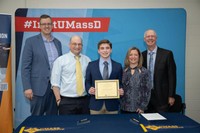 Zachary Gay with parents and principal