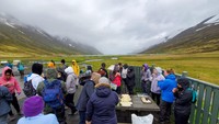 Students break for lunch in Héðinsfjörður after taking water and sediment samples in the fjord.