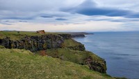 Cliff on the coast of Iceland overlooking the North Atlantic Ocean.