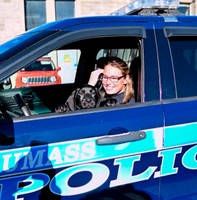 Bella and her handler, Sergeant Heather Syrett, in their police cruiser.