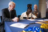 Audrey signing her acceptance letter at the Founders' Signing Day