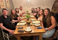 UMass Law students gather for a meal in Lisbon, Portugal.