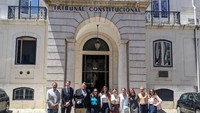 Dean Sam Panarella and UMass Law students pose in front of the Portuguese Constitutional Court in Lisbon.