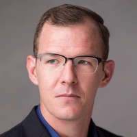 Dr. Travis L. Scholten