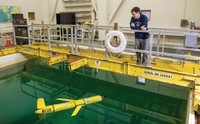 Research associate Matt Grossi testing the ocean glider, Blue in the Acoustic-optic test tank