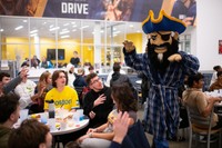 UMassD Students and Arnie at Moonlight Breakfast