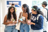Three students pictures in the Grove during Weeks of Welcome.