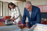 Barney Frank looking over items at the Barney Frank Collection at UMass Dartmouth