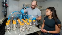 A faculty and student researcher in the Biodegradability lab