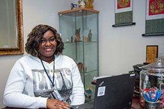 Oriane Pitah sitting at desk