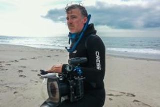 SMAST PhD grad on beach