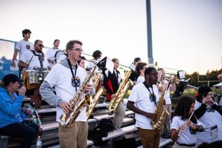Students perform in the Pep Band at a 2022 Football game