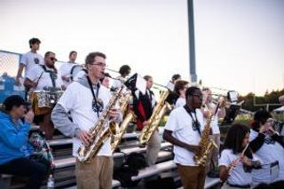 Students perform in the Pep Band at a 2022 Football game