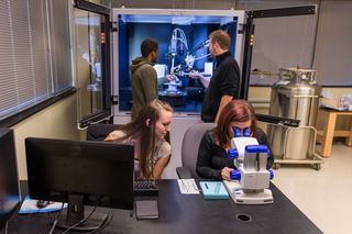 David Manke and students working with the diffractometer