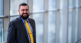 Man standing at top of staircase
