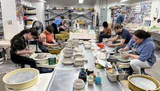 Professor Hutchinson's students at work on the empty bowls project in the ceramics studio at the Star Store (spring 2021)