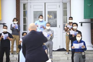 Dr. Sherwin leads the group in an outdoor performance in Bridgewater, April 2021.
