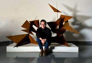 Fiona M. Marques portrait with sculpture