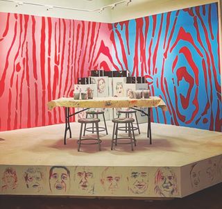 David R. Modler: Draw and Play Here, 2022. Acrylic painted directly to wall (10 x 20 feet), spray enamel painted stencil portraits, and collaborative visual journals.