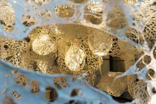 Katy Rodden Walker Enmeshed (detail), 2022, clay slip, cheese cloth, glue, led lights, wire, string, ~9’ x 10’ x 5’