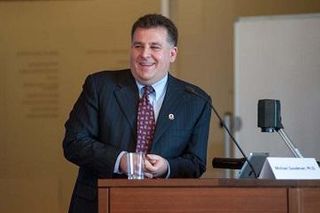 Michael Goodman at a podium