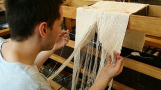 Christopher Rogers working at loom