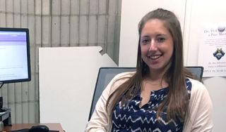 Jennifer Legee working at desk.