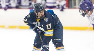 Student playing hockey